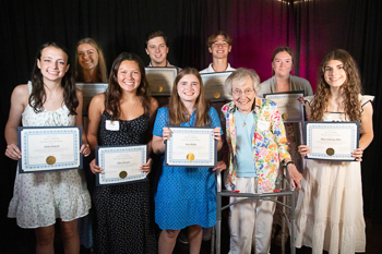 A group of teens holding their certificates.