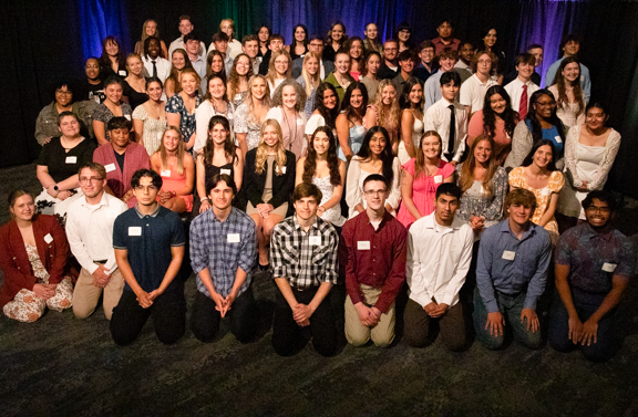 Group photo of 80+ scholarship recipients.