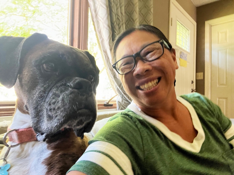 A selfie of a woman and her dog.