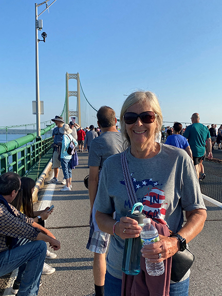 Pam standing on the Mackinac Bridge.