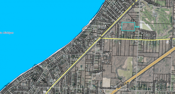 Arial view of parcels of lad with one section highlighted.